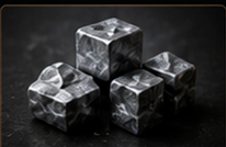 Polished zinc cubes on a dark surface